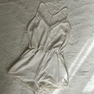Kittenish white romper